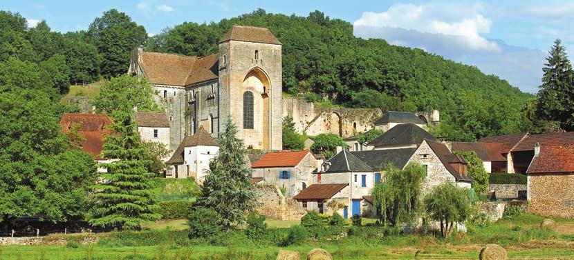 Lauze-roofed, medieval maisons (houses) surround Saint Amand-de-Coly s yellow limestone Augustinian abbey church.