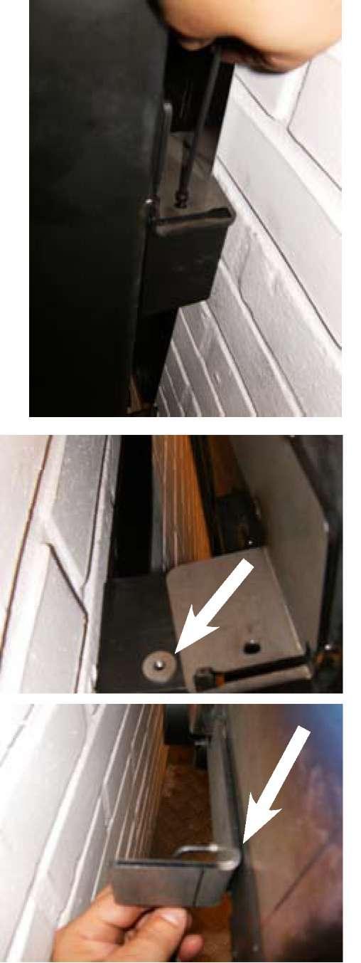 Lift the burning chamber ( without door or panels ) onto the wall bracket.