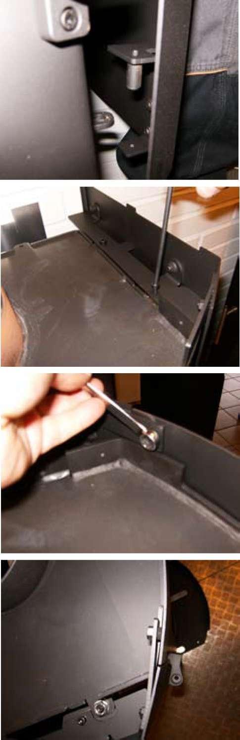 Lift the side panel onto the guides at the bottom of the stove.