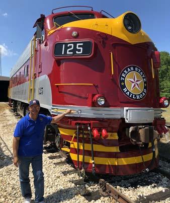 610 stands next to gleaming, new Texas State Railroad FP9 No.