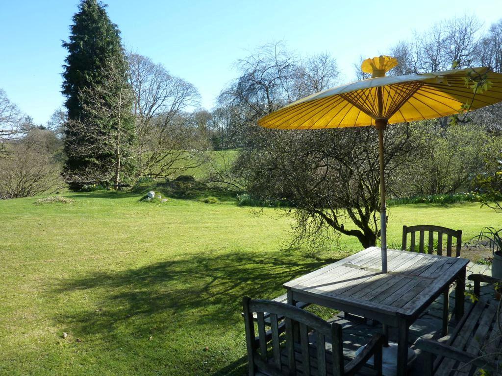 The delightful peaceful gardens feature lawns and an interesting array of specimen trees and fruit trees and an eating