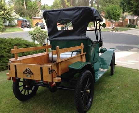 100 YEAR OLD MODEL T 1914 Model T Ford Roaster-pickup. Brass radiator, green exterior, black interior, wooden spokes. Engine and transmission believed to be original.