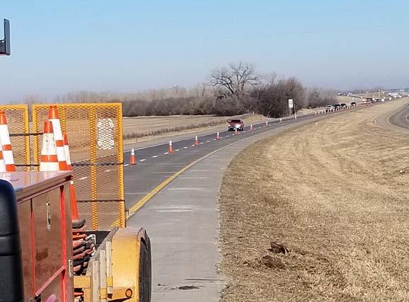 District Two Above: Equipment Operator Rocky Lindgren places cones to move traffic over (seen at top right) in preparation for guardrail repair work.