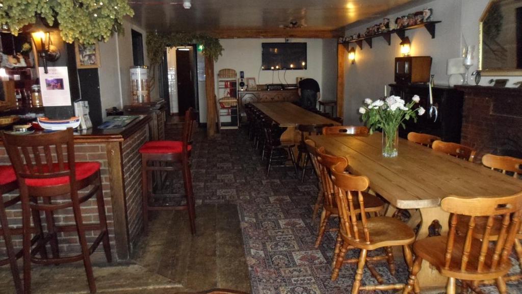 Drinks can be served at the table on request. There is a 2 seater low sofa in the Main Bar. Tables & chairs are standard wooden kitchen style chairs without arms as shown in picture above.