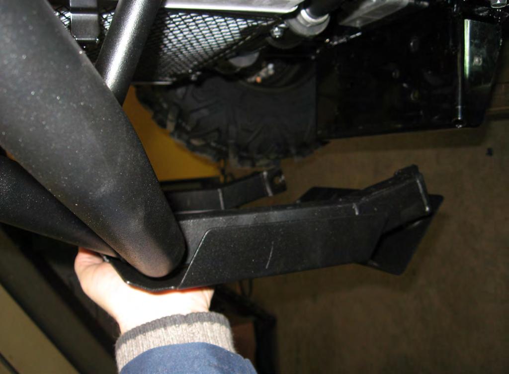 4. Rotate bumper up and place plow mount on vehicle frame plate and