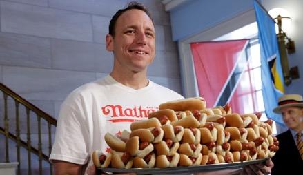 Joey ate 74 hot dogs in 10 minutes which is a new world record. Yep... SEVENTY FOUR! He really is a 'top dog'.