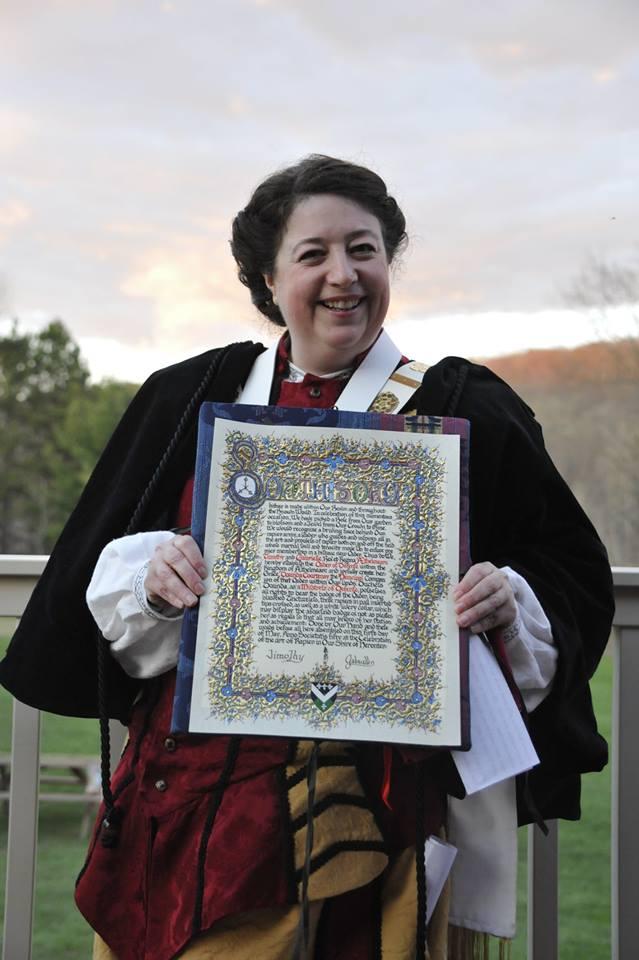 The Vigilance July August A.S. L 2015 C.E. Duchess Dorinda with her Order of Defense scroll.