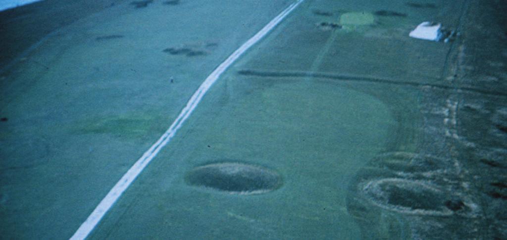 9 Bronze Age burial mounds (barrows) along the Tennyson Trail, photographed from the air.