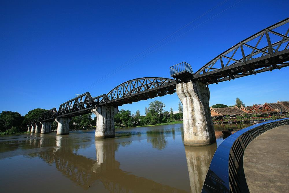 BRIDGE OVER THE RIVER KWAI Perhaps the best known attraction of Kanchanaburi, featured in world s famous book and film, The Bridge on the River Kwai is part of the infamous Death Railway, spanning
