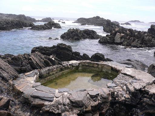 Having a break at natural Onsen on the rocky beach is a nice