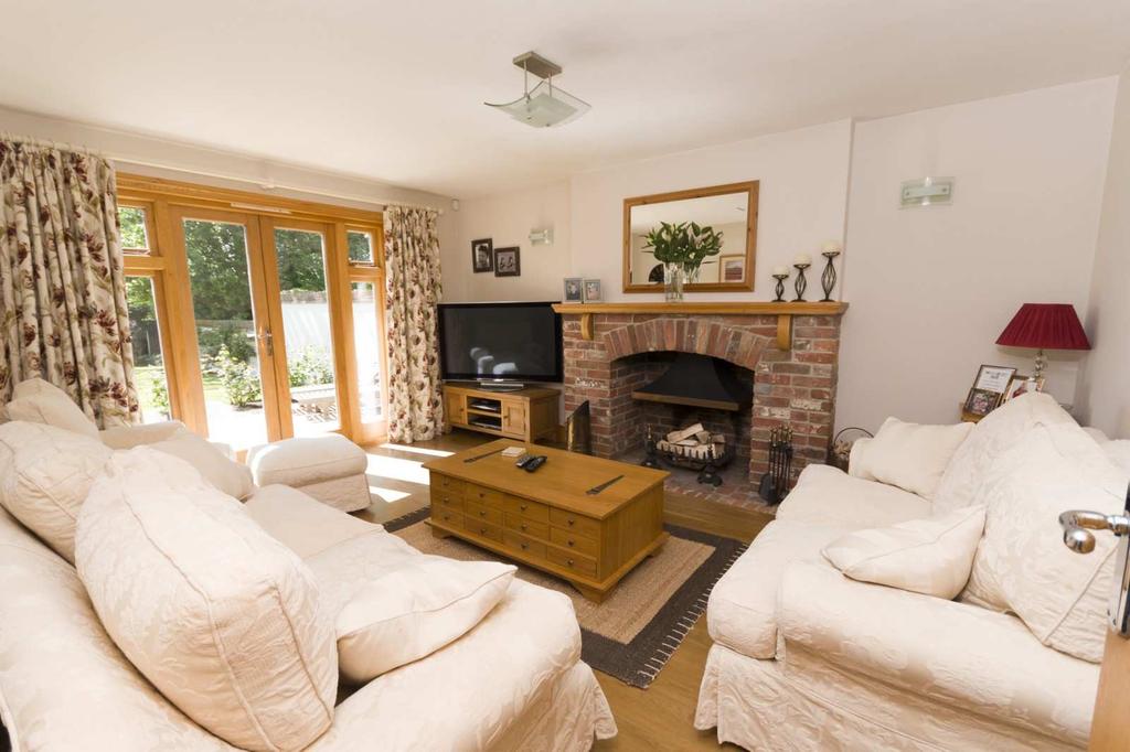A BEAUTIFULLY PRESENTED 5 BEDROOM DETACHED HOUSE WITH AN OUTSTANDING RURAL VIEW, situated in an idyllic rural location at Witchampton Mill, on the