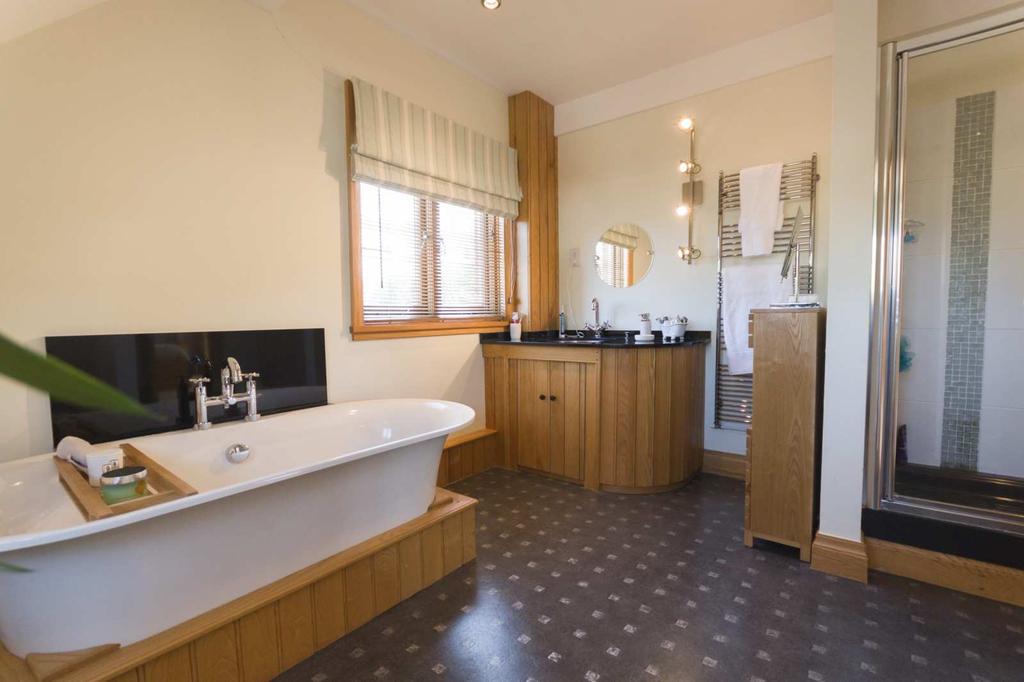 ) On the ground floor, there is a large entrance hall with Travertine flooring, a cloakroom, 3 separate reception rooms (with wide oak boarded floors,) and a kitchen/breakfast with hand-painted