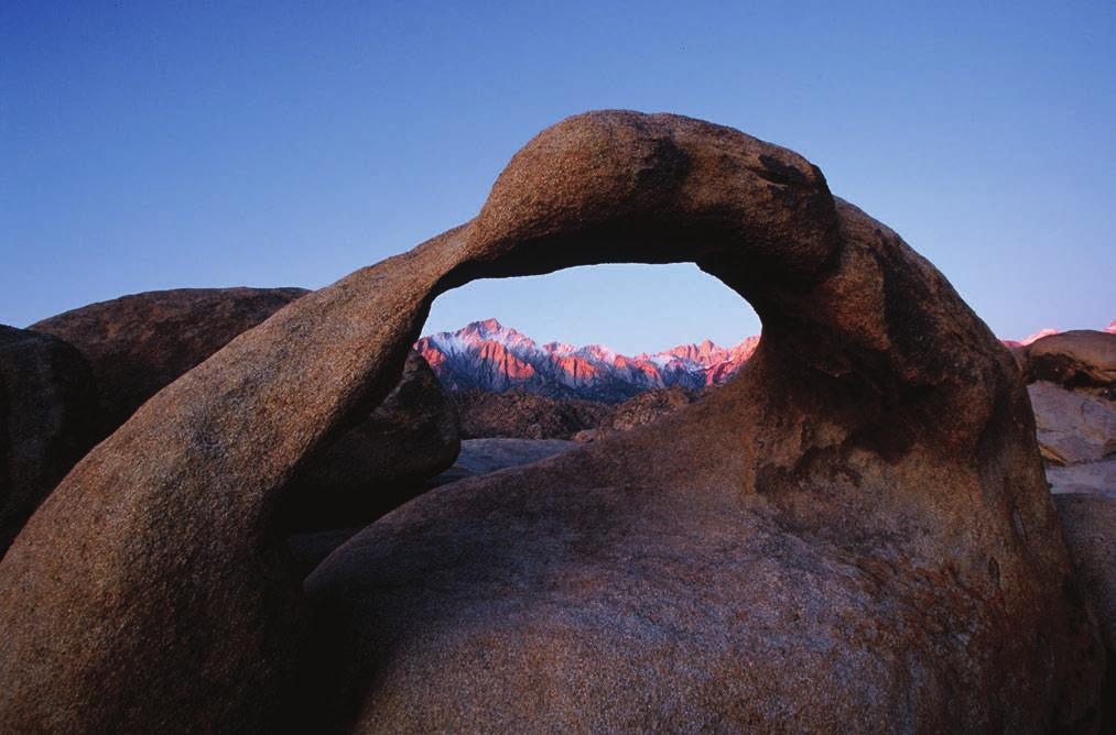 IMAGES MADE IN THE MOUNTAINS CHUCK GRAHAM Granite arch in the Alabama Hills framing from left to right Lone Pine Peak and Mount Whitney, Eastern Sierra, CA mountains, and after scaling a peak I would