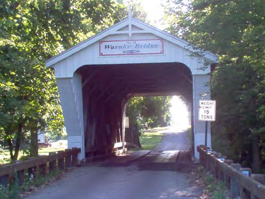The little iron pony-truss bridge that stood there had been baldy damaged by a flood in 1895.