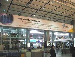 banners) Kowloon Station: G) Above Flight Info.