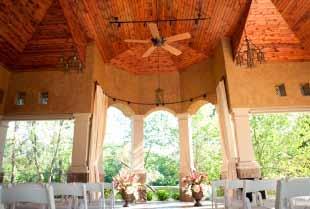 The Pavilion Venue Details Stucco and Stone Exterior combined with Beautiful Wood Ceilings and Wrought-Iron Details Cream colored curtains