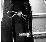 DO NOT use air driven guns or impact wrenches to lift the spare tire to the travel position.