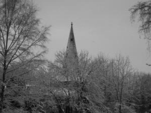 The growing trees which surround the church still allow the very top of the church to be seen from the riverside.