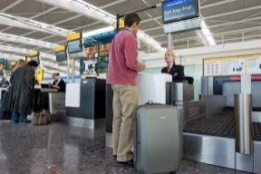 You will need to scan your boarding pass at the automatic gates, or show it to the person on the desk, to go through