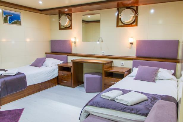 In addition each cabin has life jackets, desk and tabouret, wardrobe, night stand, small sofa and a porthole window.