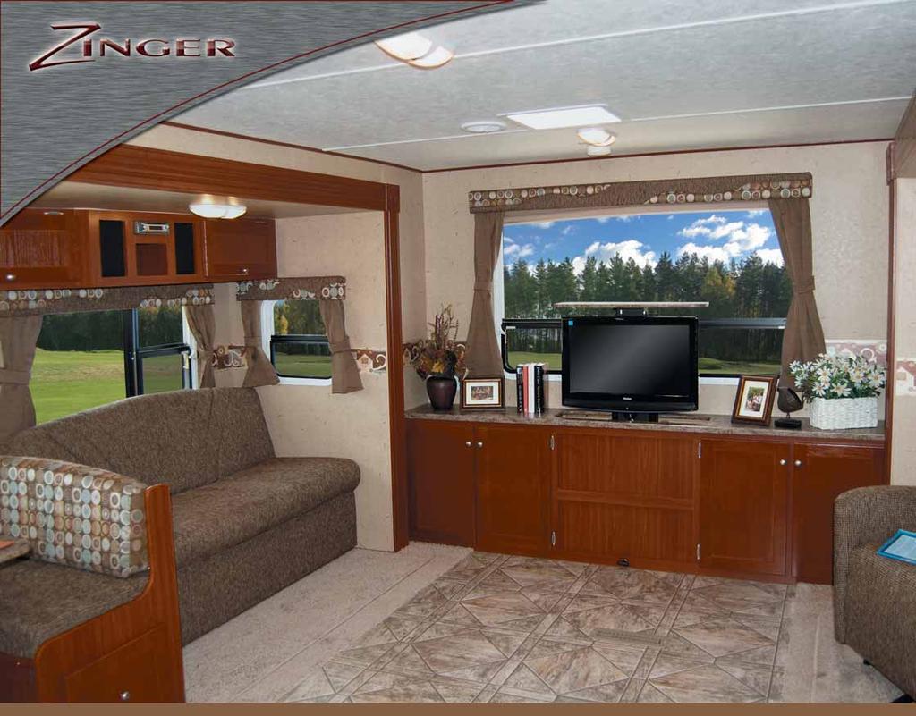 ZT29DS Rear living area shown with Spa décor and standard 26" LCD TV that lowers into the base cabinet 2 The Zinger is all about family.