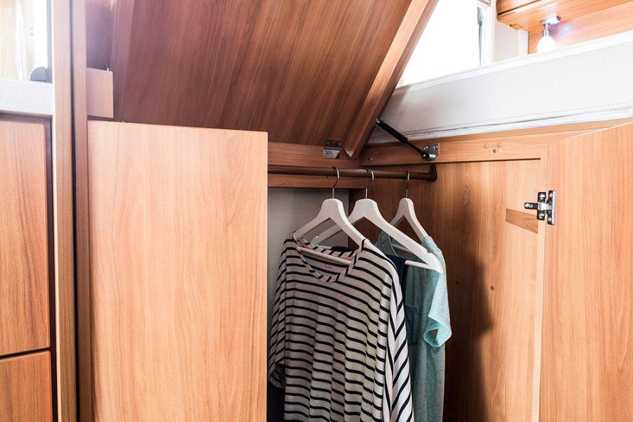 There is a large, convenient wardrobe underneath the hinged twin beds in the HYMER Van 374, where items of clothing can be stored away tidily.