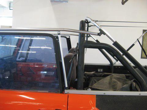 Step 8 Unfold the canopy and place it on top of the assembled frame structure and snap it to the windshield header. Now attach the rear snaps over and around the rear crossbar.