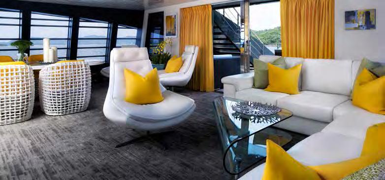 The main deck saloon s floor-to-ceiling panoramic windows provide