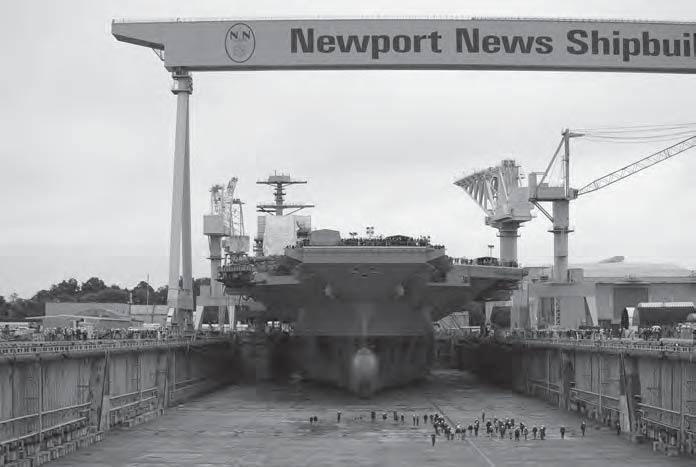T H E P O R T S O F V I R G I N I A The Gerald R. Ford (CVN 78) carrier, the first in the Gerald R. Ford-Class, sits in Dry Dock 12 in preparation for dry dock flooding.