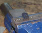 place in a vise at a 45 angle to the