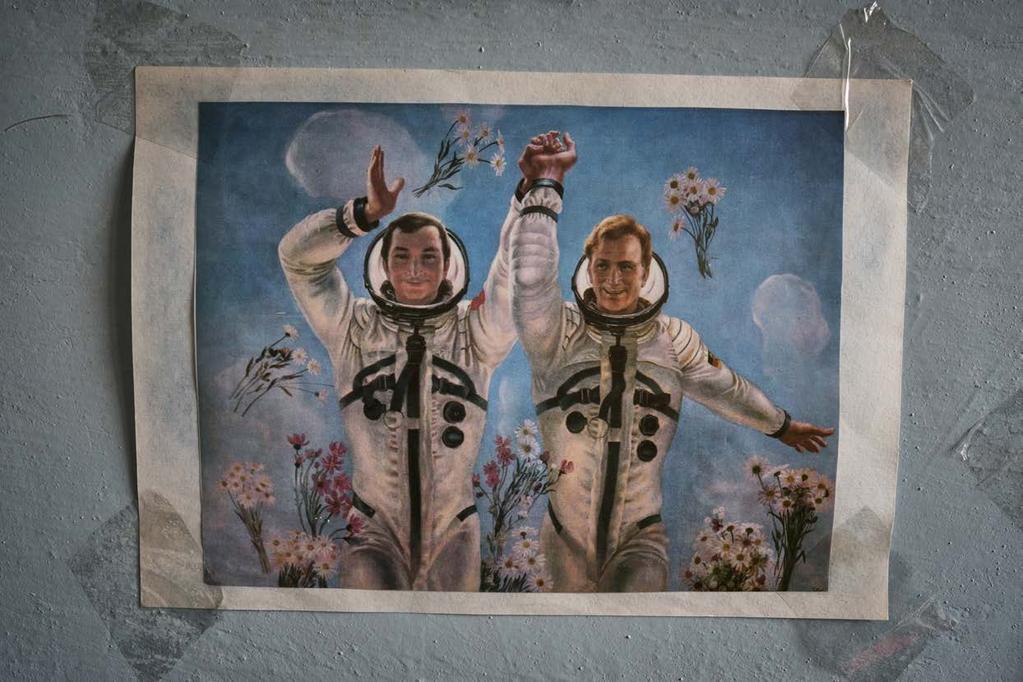 An old USSR poster hanged on Jimmy s apartment showing USSR astronaut Valery Bykovsky