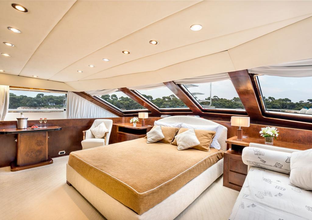 MASTER SUITE With large panoramic windows, upon waking in the light and airy master cabin guests
