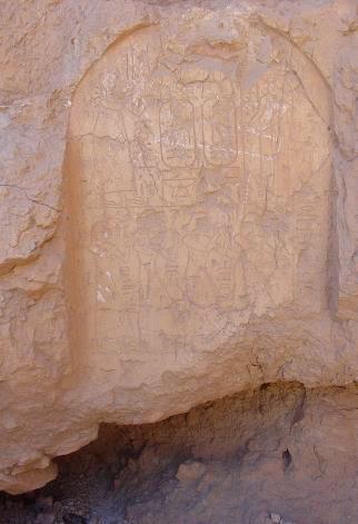 Of the two remaining stelae, the one to the upper right has been severely affected by vandalism, exhibiting extensive white scratch marks that appear to be relatively recent given their