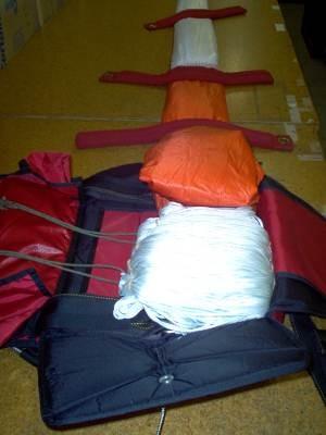 Follow procedures in our standard packing instructions for back style parachute.