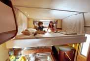 In just a few manual steps or electrically as an optional extra (depending on the model), the ceiling is lowered, giving way to two full-size berths.
