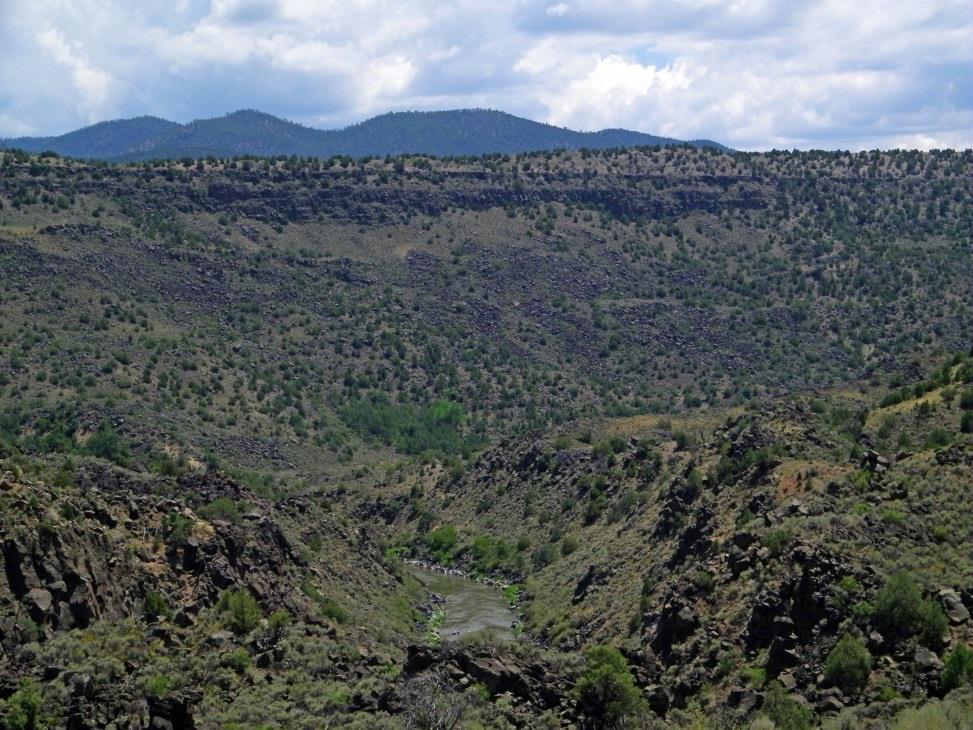 like the Columbian Plateau in eastern Washington state. Over the eons, the Rio Grande River carved a deep canyon through the rock.