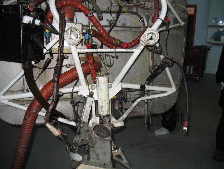 Figure 5: Dented engine support assembly. The engine support assembly was bent in several places as shown above. 1.4 Other damage. The signalisation board (S4), located left of the runway at 16.
