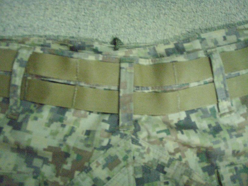 Fig. 13 The belt line sides and rear of the pants has an integrated molly system. This feature allows for easy attachment of molly pouches and drop leg sub loads.
