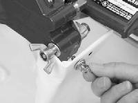 (A) Loosen Adjustable Cutting Guide retaining thumbscrew and place it over the Movable Cutting Table and