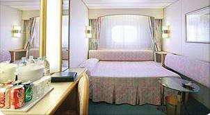staterooms, featuring luxurious bedding and eye-popping