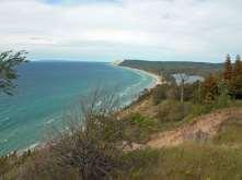 #3 Empire Bluff Hiking Trail Location: The trailhead is located on Wilco Rd. off of M-22 south of Empire. Distance: 1.5 miles round trip from the trailhead to the overlook deck.