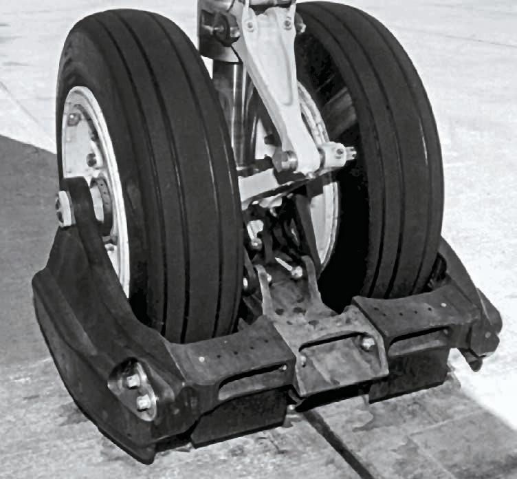 Figure 4: Nosegear device An MD-80 type is equipped with a combination nosegear spray FOD deflector for normal operations. The ground clearance of this deflector is 0.75 to 1.5 inches (1.9 to 3.