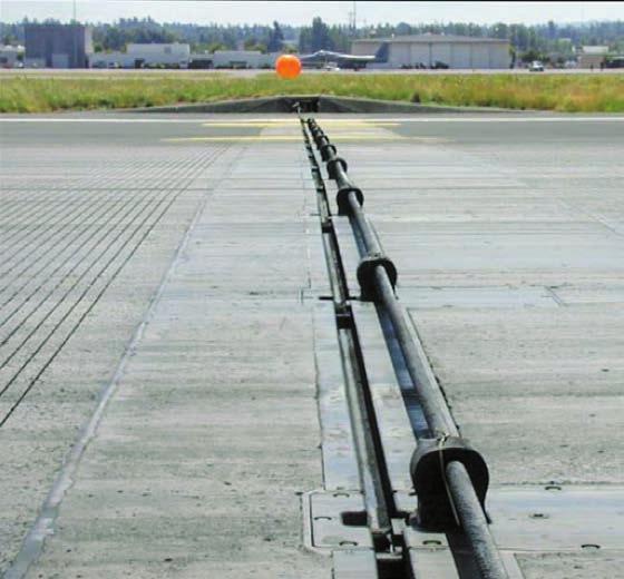 Figure 7: Retractable cable A BAK-14 modification enables air traffic control personnel to remotely raise (left) and lower (right) an arresting cable. Dealing with arresting barriers.