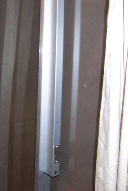 The cable is connected to the interior of the upper door frame with an eyelet and single screw.