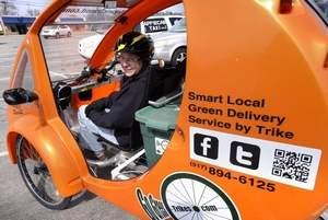 ZOOM Yvonne LeFave in her ELF eco-friendly delivery vehicle in Lansing Tuesday 4/24/2014 for her Go Green Trikes business.