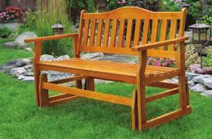 75"H WOODEN GLIDER BENCH Drift away to a world all your own on this glider bench crafted of