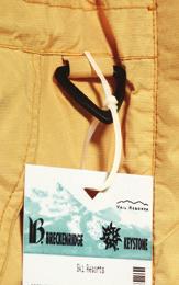 skier in zipping their coat by extending the zipper length The Badge Holder is tamper resistant and smooth up to the restriction point to keep it from being shared or reused by other skiers The