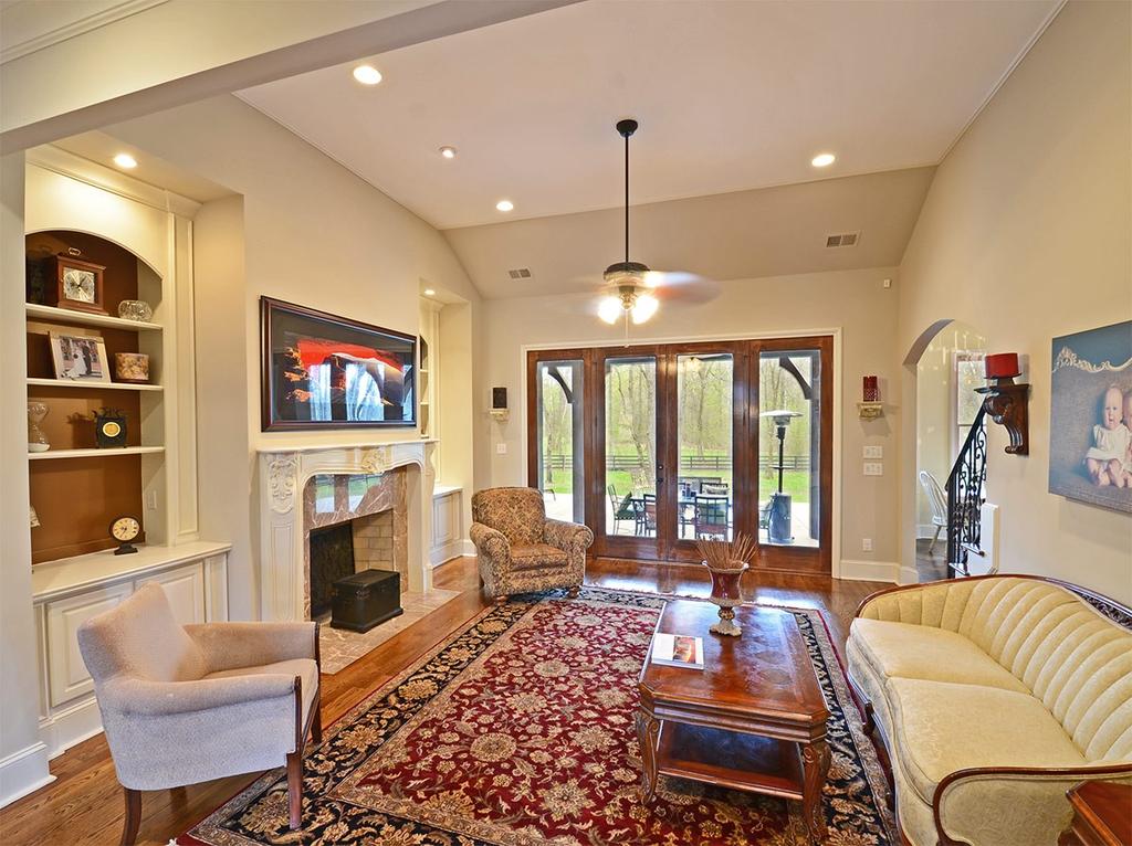 Great Room Toast your toes by the cozy fireplace in the great room with built-in bookcases,