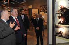 " Greek Foreign Minister Nikolaos Kotzias (second from left) was guided through the Holocaust History Museum by Director of the Yad Vashem Libraries Dr. Robert Rozett (left).