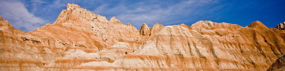 Later, you ll venture into the Badlands, where rain and frost have carved the landscape into colorful spires and massive